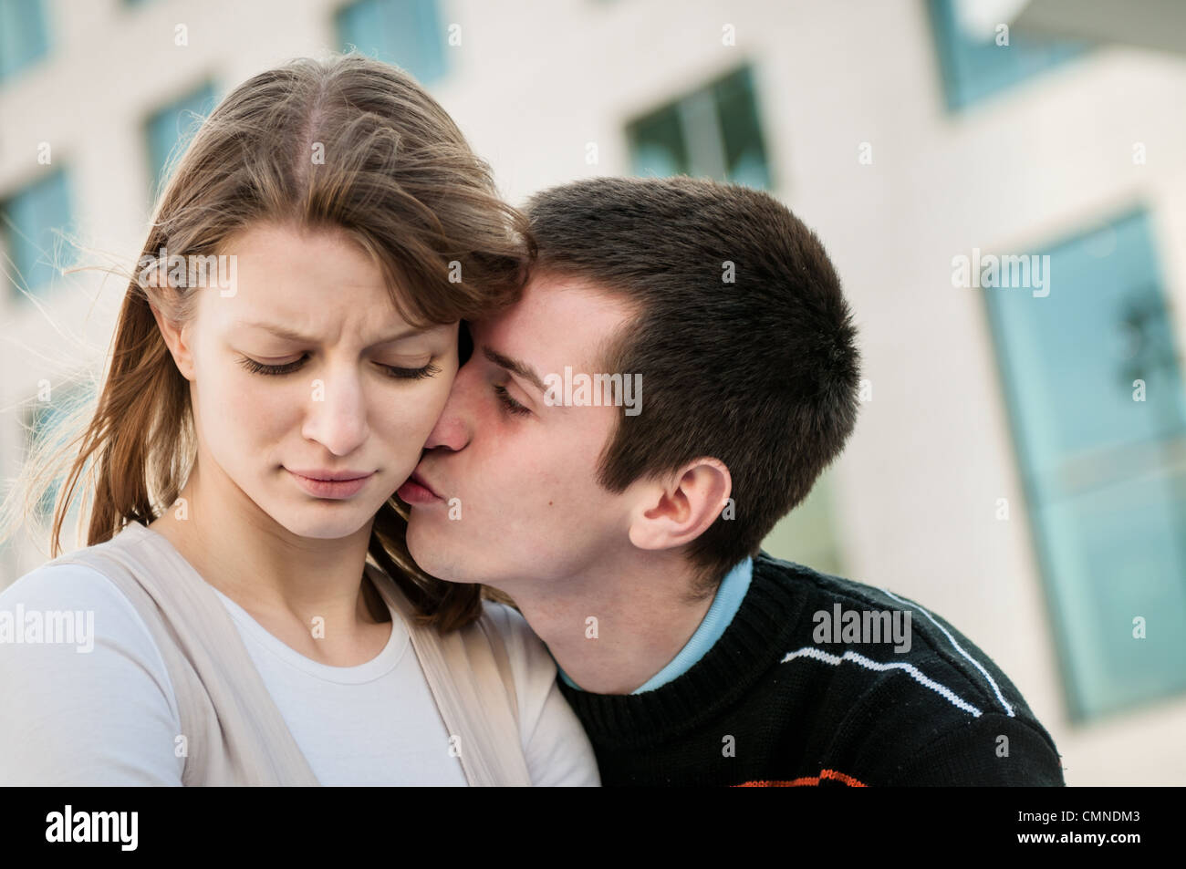 Relationship problems - man trying to reconcile with offended woman Stock Photo