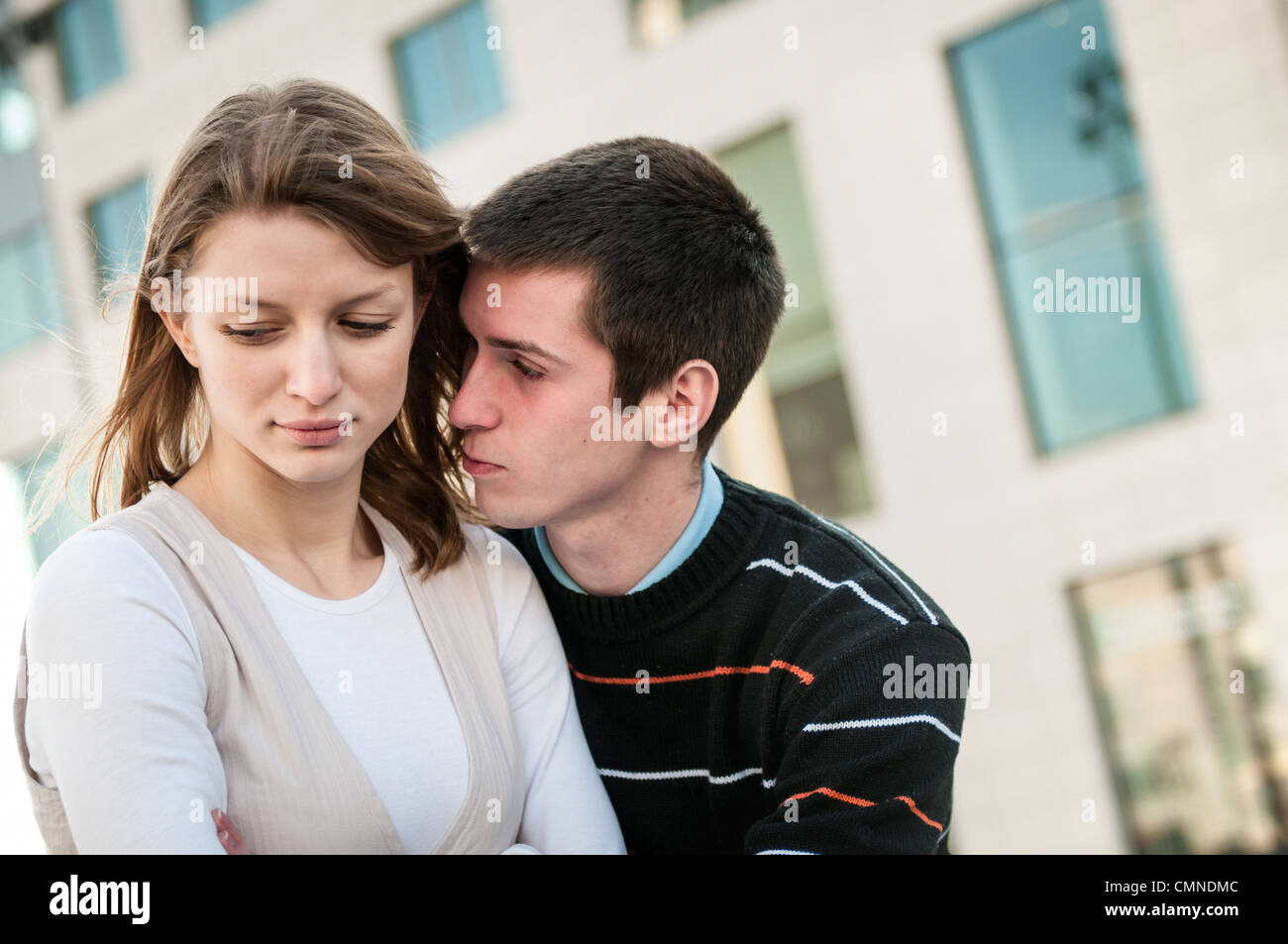 Relationship problems - man trying to reconcile with offended woman Stock Photo