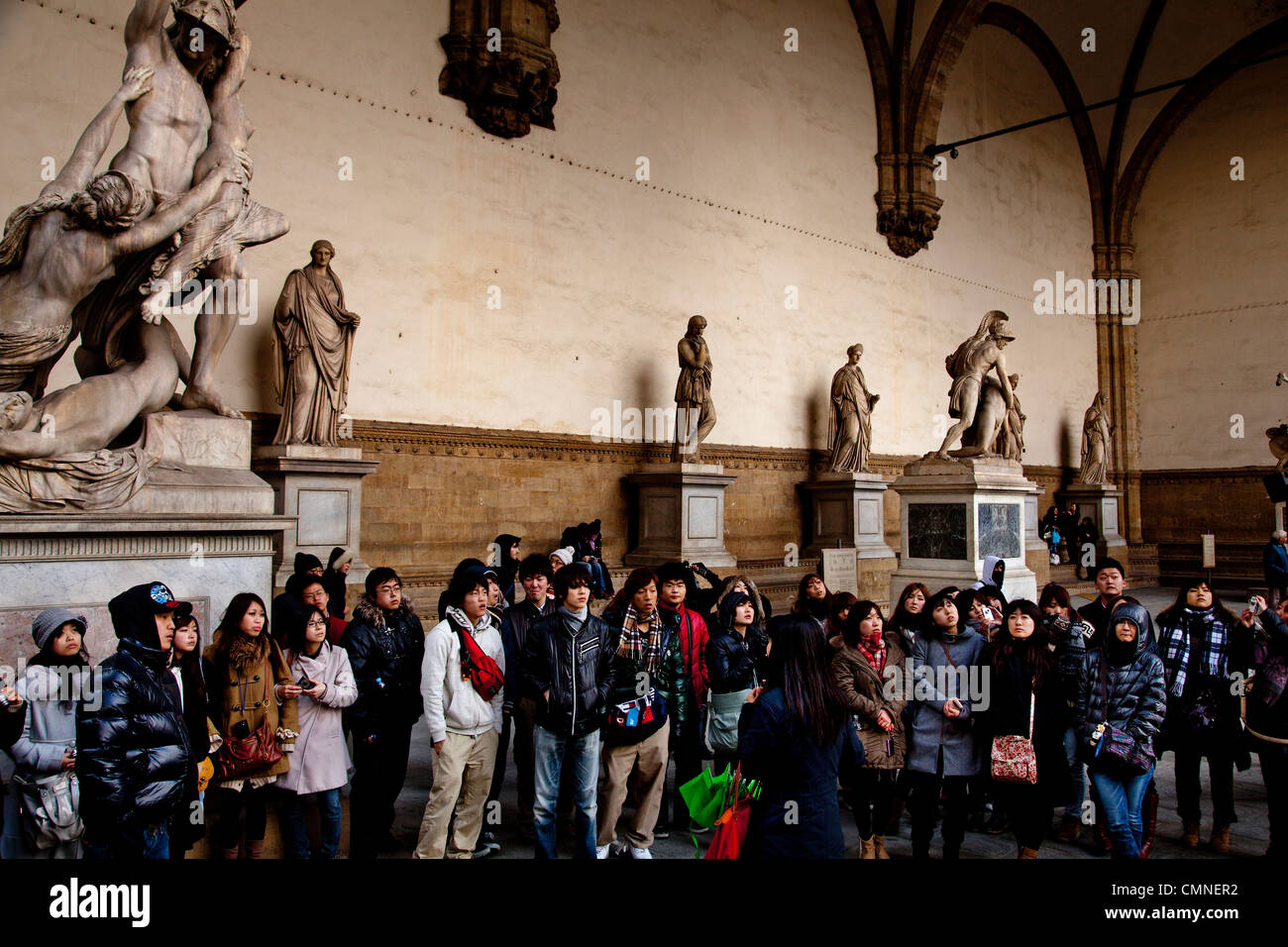 Tourists visiting Romano Greek statues in the Piazza della Sinoria, Florence. Stock Photo