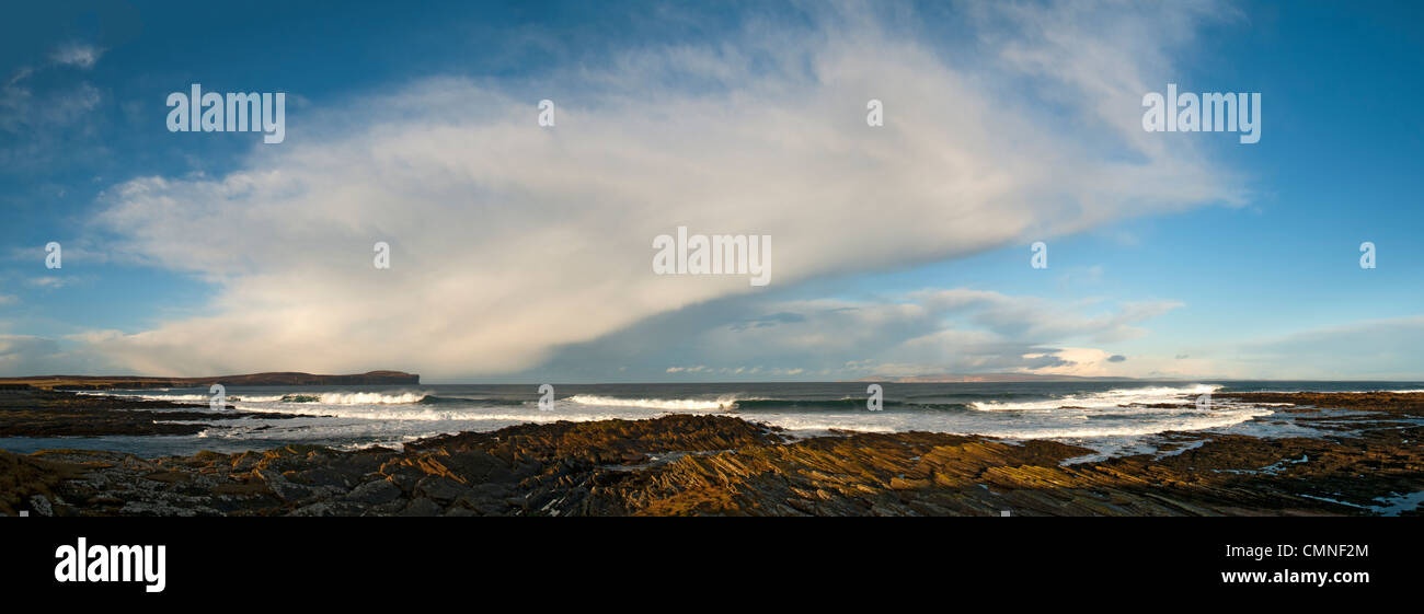 Cumulonimbus shower cloud over the Pentland Firth, Caithness, Scotland, UK. Dunnet Head on left and Hoy, Orkney Isles, on right. Stock Photo