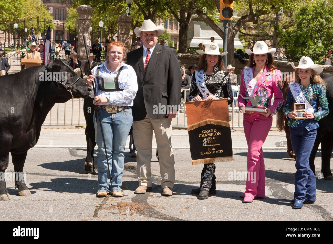 Grand Champion Steer event  winner  parade entries front of the Texas Capitol with Rodeo beauty  queens in cowboy hats Stock Photo