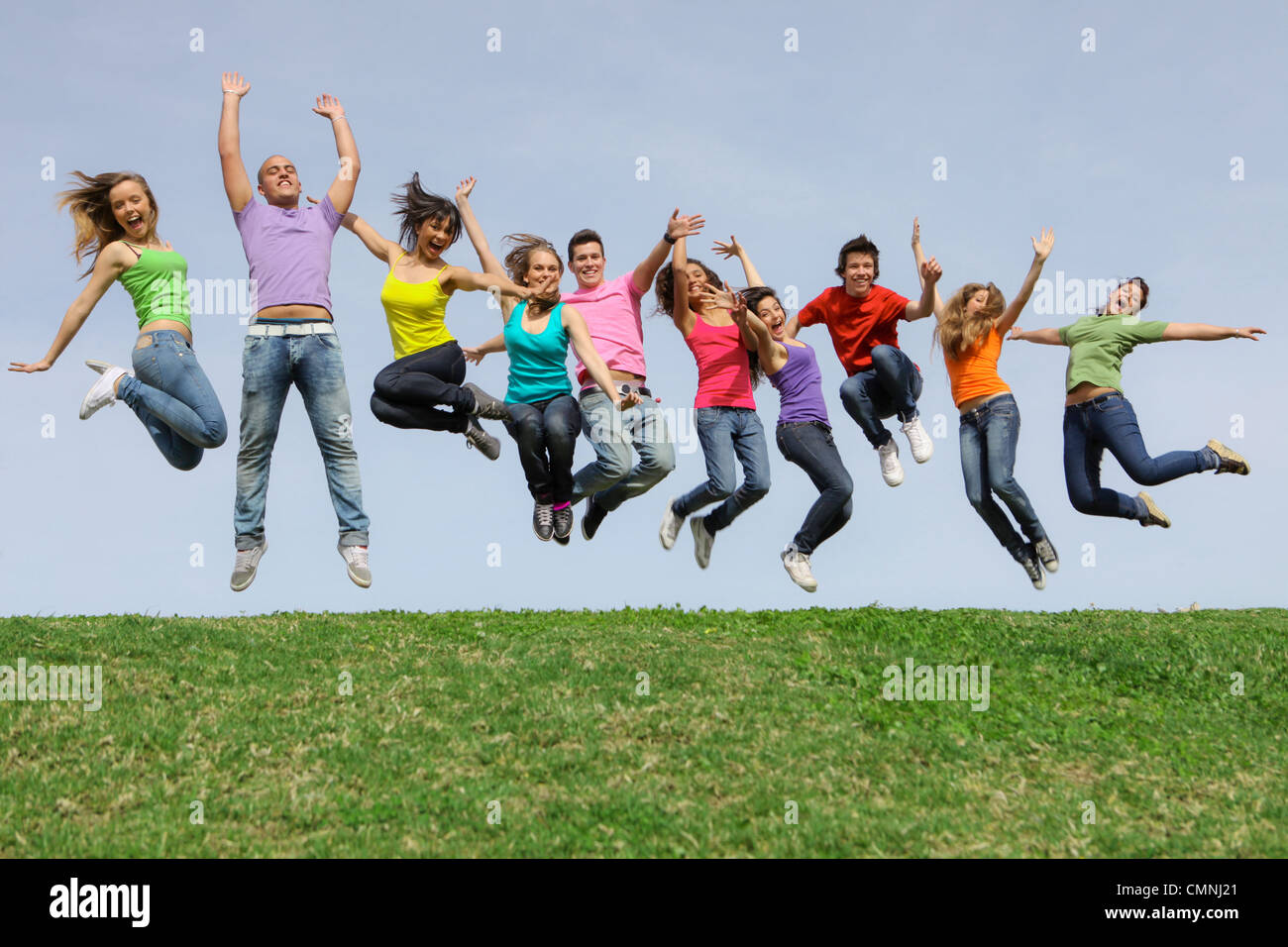 group of happy healthy diverse mixed race teens jumping Stock Photo Alamy