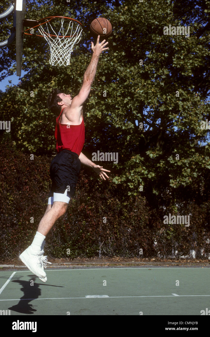 Men's outdoor basketball pickup game Stock Photo - Alamy