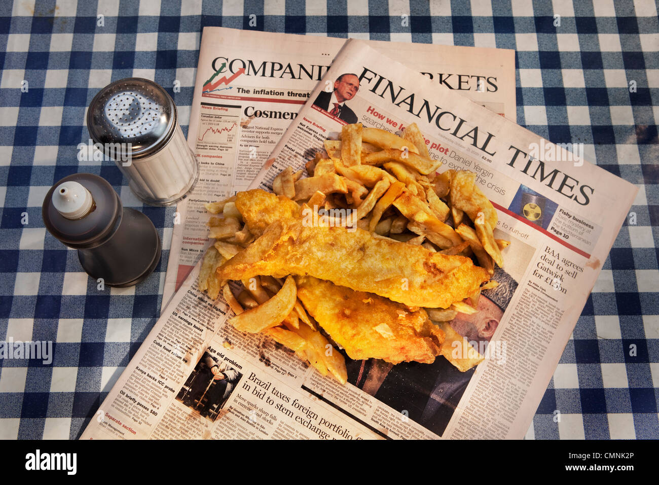 Traditional fish and chips served on the Financial Times Stock Photo