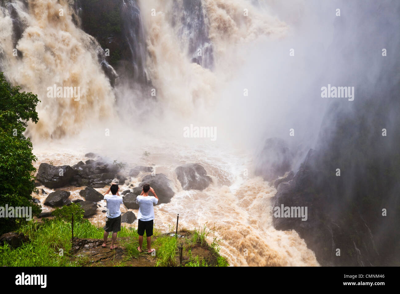 Hikers look out over Barron Falls during the rainy season. Kuranda, Cairns, Queensland