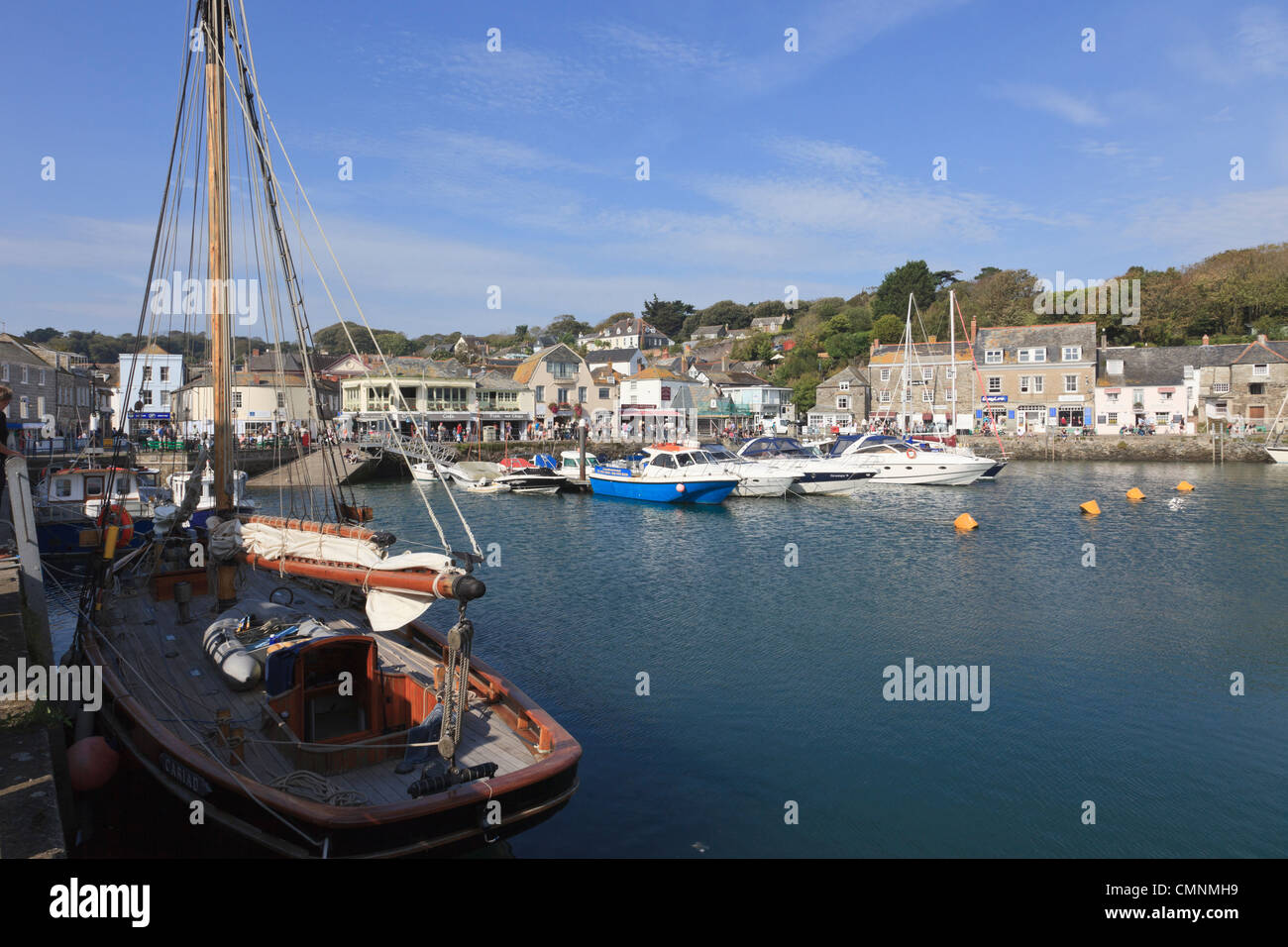 Padstow, Cornwall, England, UK, Great Britain, Europe. Village harbour scene with boats moored on Cornish coast in late summer Stock Photo