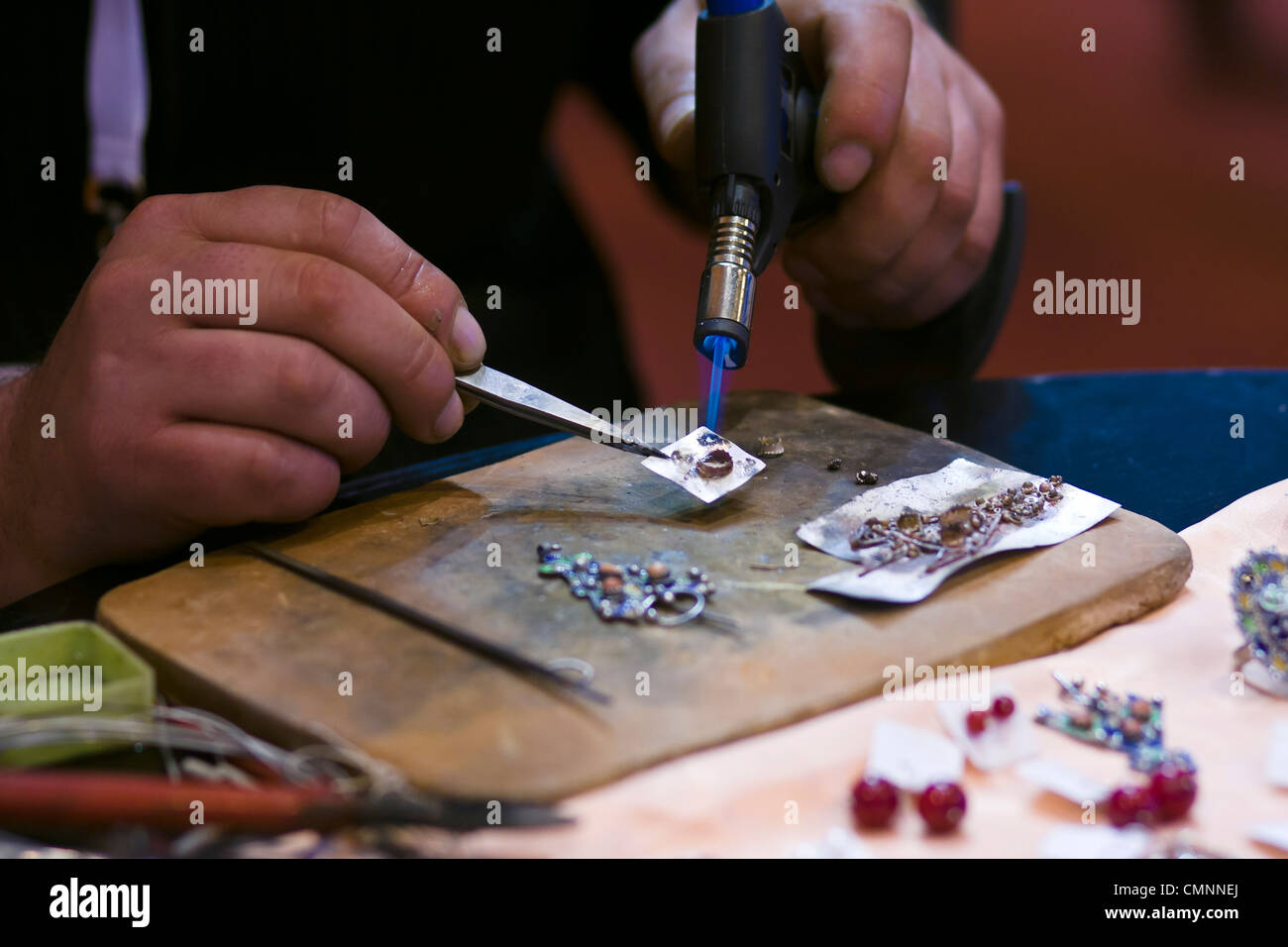 Egyptian jeweller at work International Tourism Show 2012 Paris Stock Photo