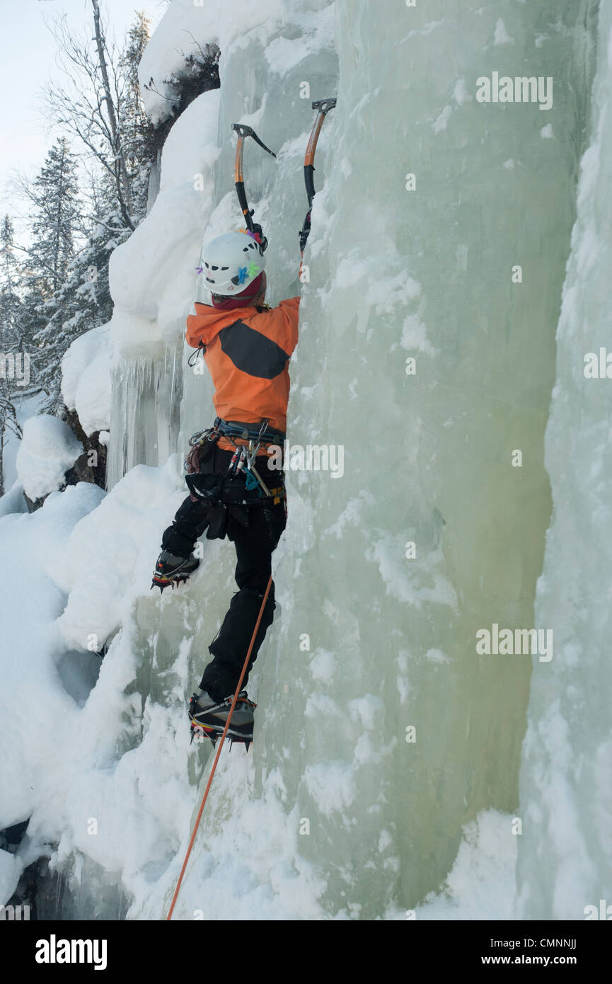 ICe climber lead climbing in Korouoma, Finnish Lapland Stock Photo Alamy