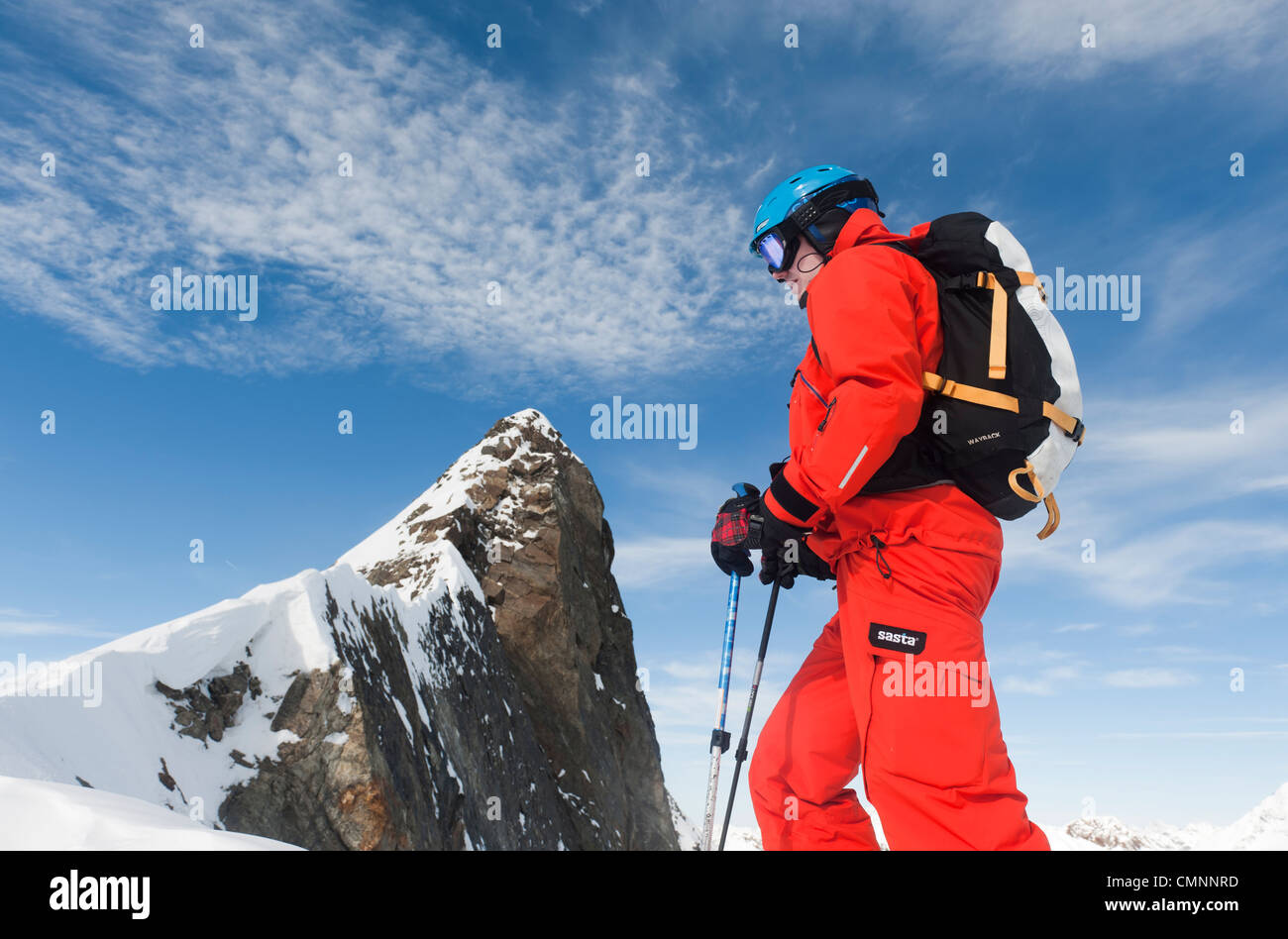 A free skier climbing up a steep rodge in Stubai, Austria. Stock Photo