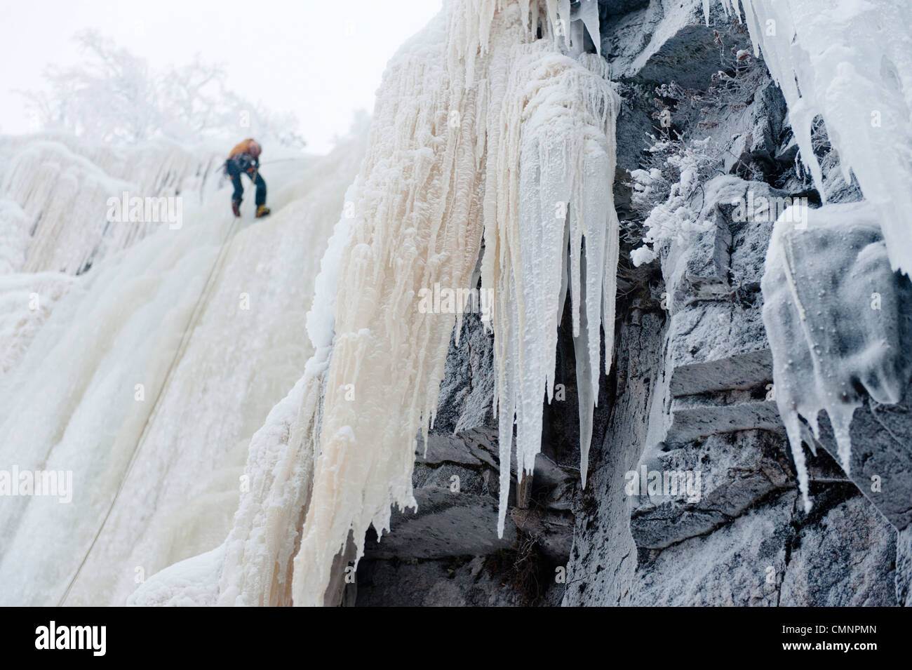 Man climbing ice fall hi-res stock photography and images - Alamy