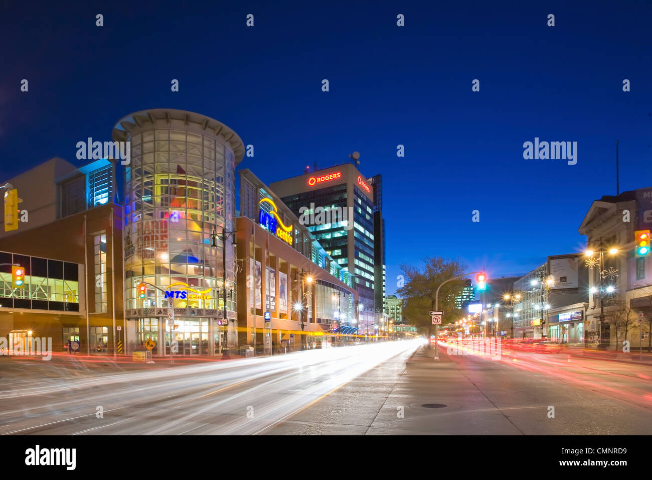 MTS Centre Arena and traffic at night on Portage Avenue,  downtown Winnipeg, Manitoba Stock Photo