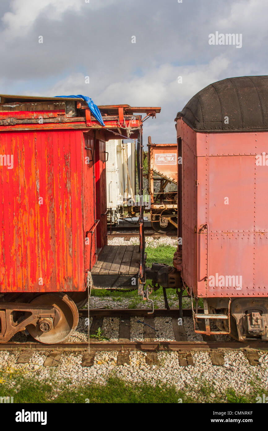 Vintage railroad cars, many from 1920s, in train yard at Austin and