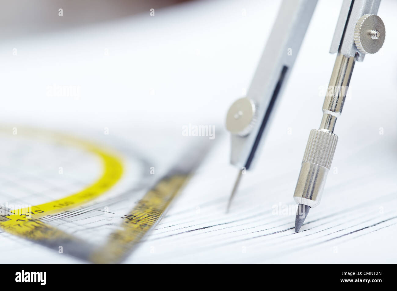 Compasses and ruler on a graphic. Extremely close-up photo Stock Photo