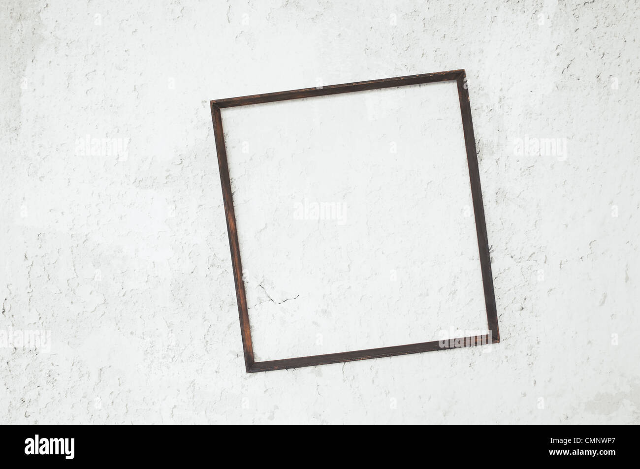 Picture frame on grunge wall. Stock Photo