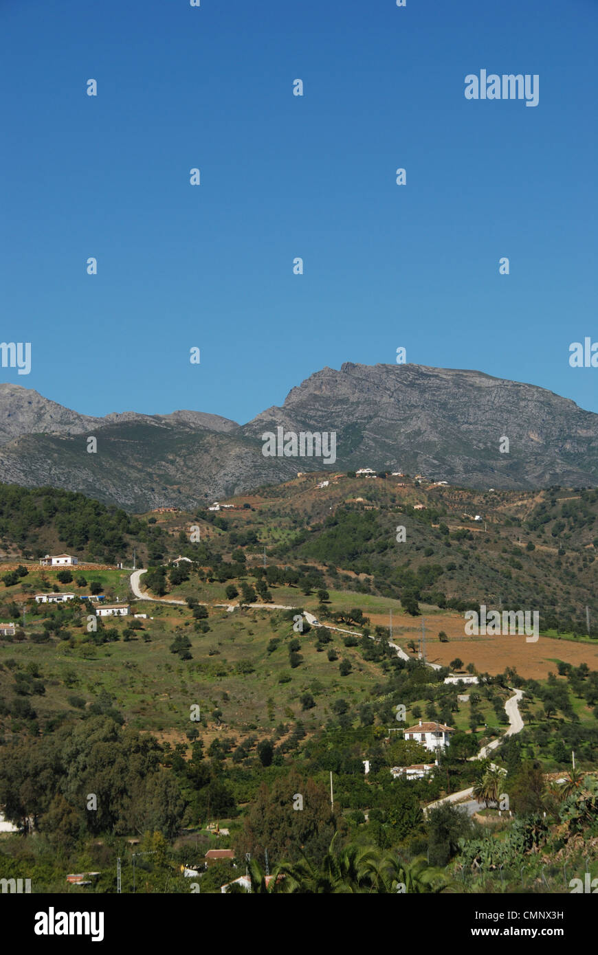 Country houses and surrounding landscape, Near Tolox, Malaga Province, Andalucia, Spain, Western Europe. Stock Photo