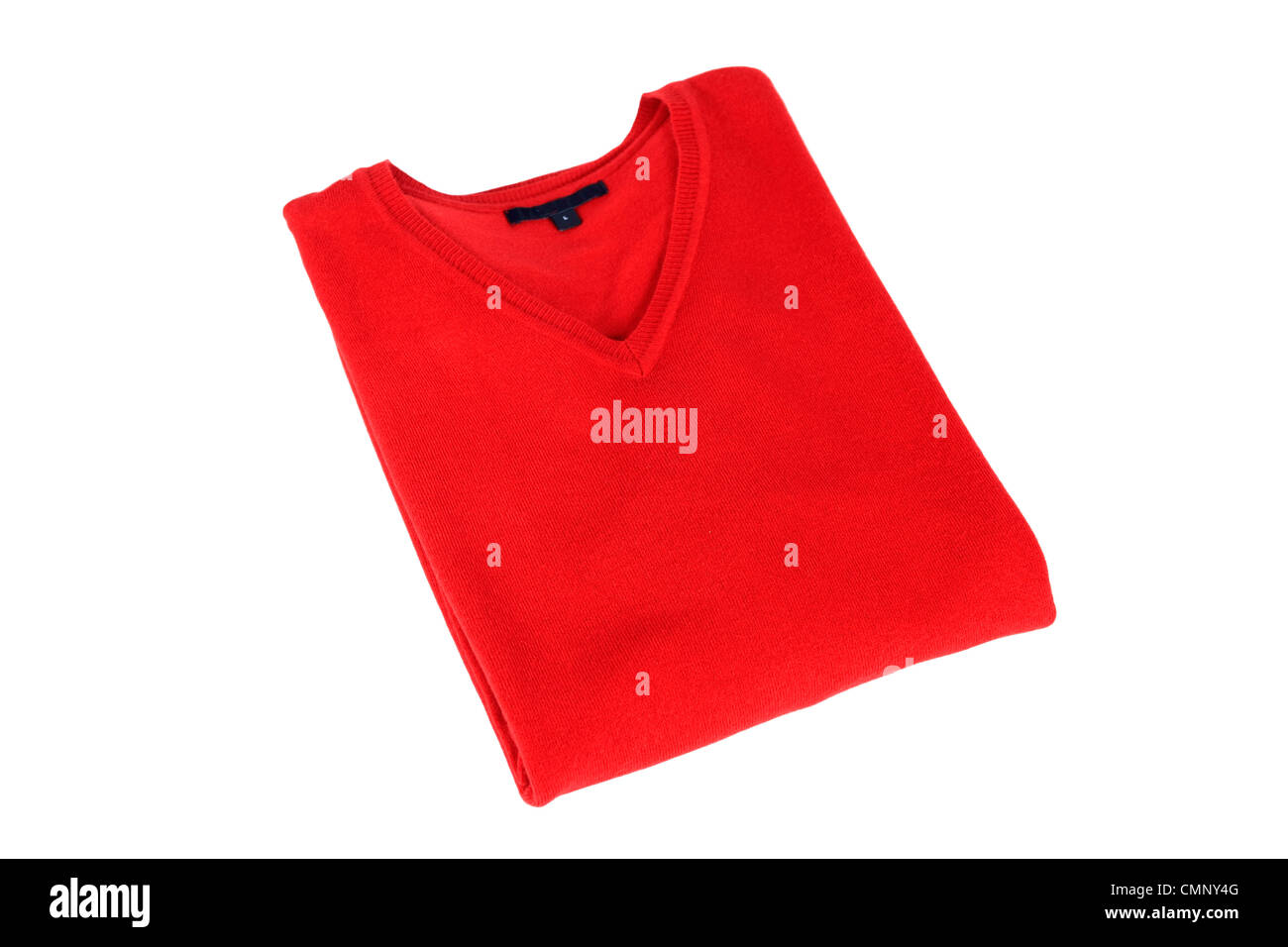 A folded red man's sweater on a white background Stock Photo - Alamy