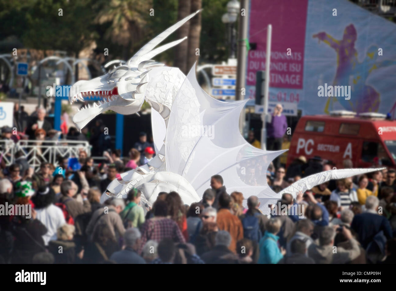 Carnaval de Nice 2012. cartoon effigy ofwhite Dragon during Carnival parade. 124412 Nice Carnival Stock Photo
