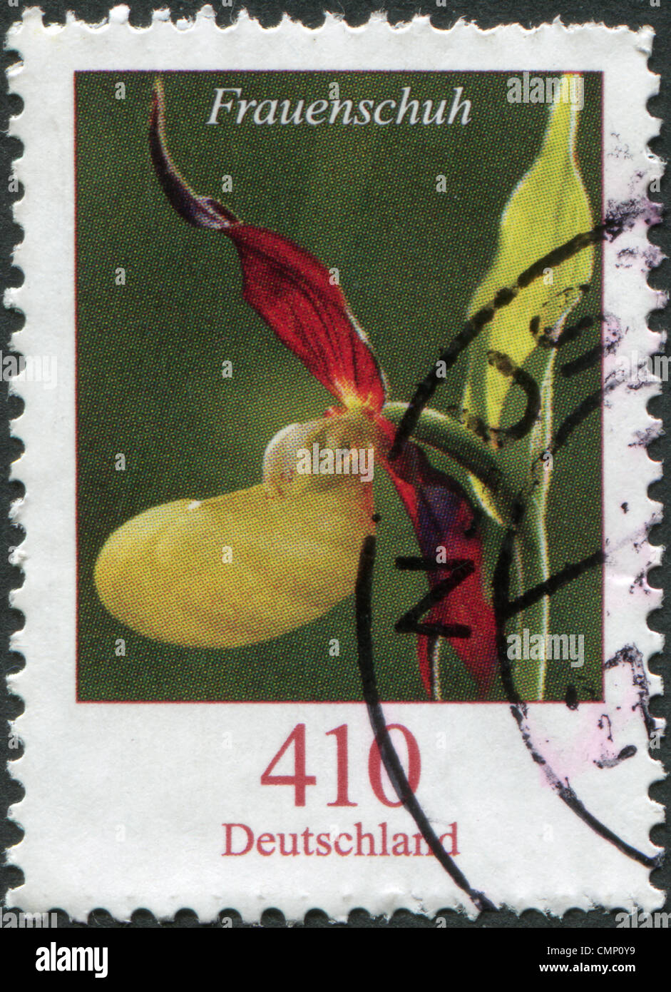 GERMANY - CIRCA 2010: A stamp printed in Germany, shows a flower, Cypripedium candidum, circa 2010 Stock Photo