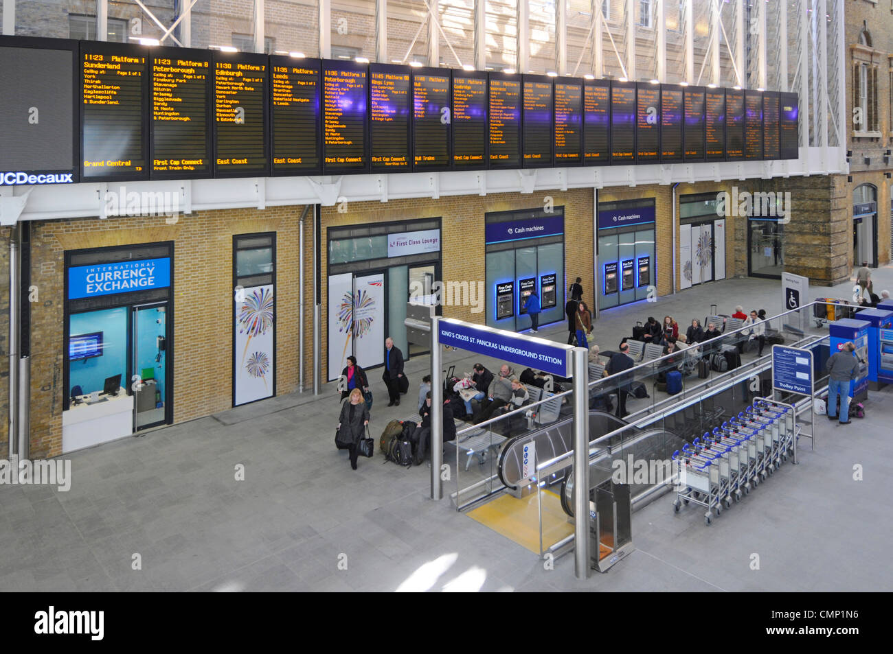Kings Cross Railway Station departure boards and passenger seating