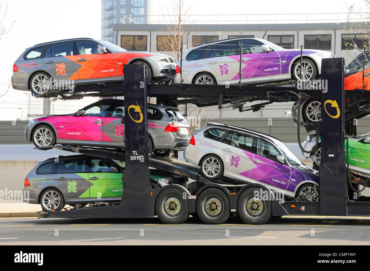 Car Transporter loaded with BMW cars painted in London 2012 Olympic games colours Stock Photo