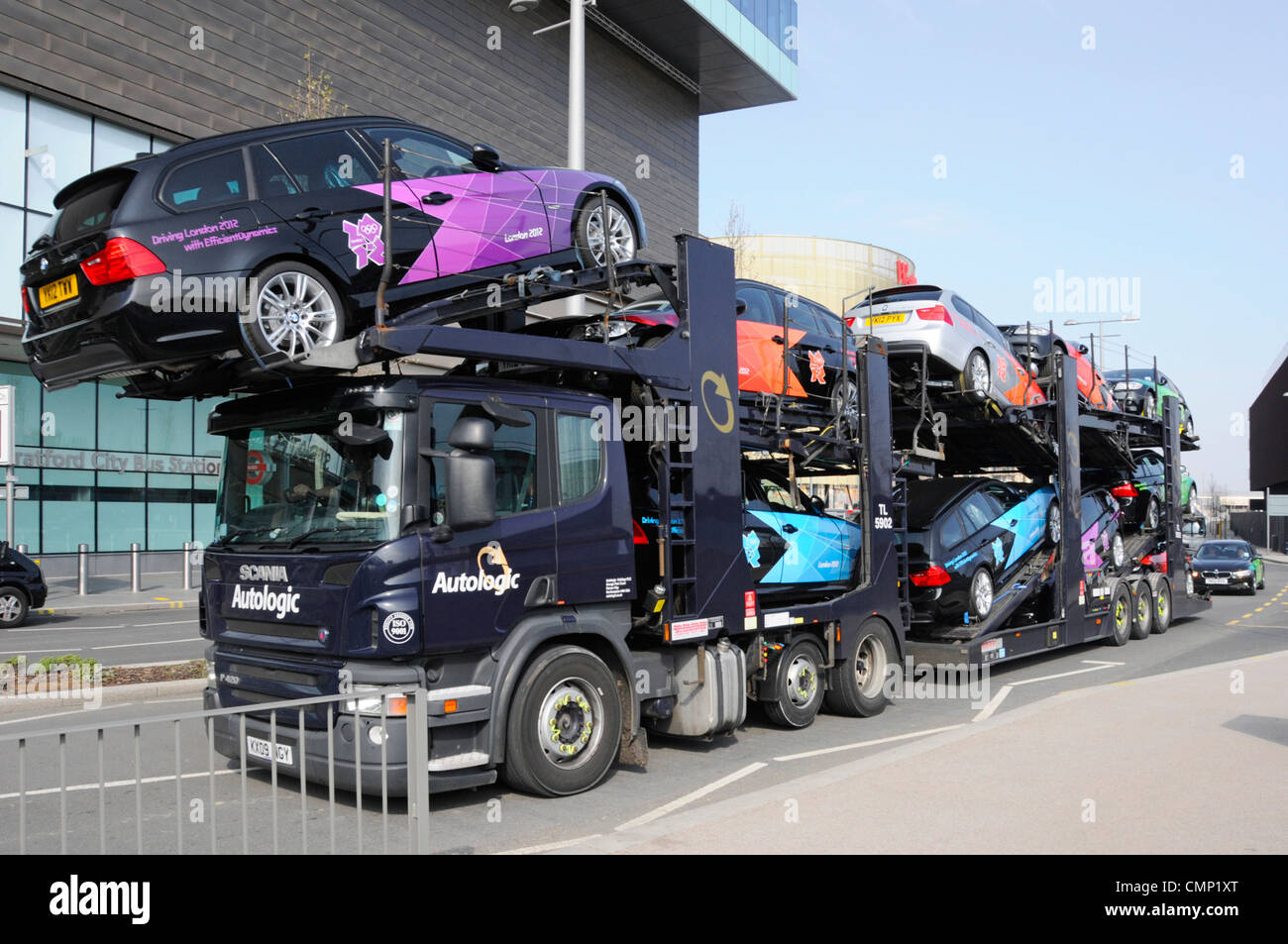 Autologic Car Transporter BMW cars painted in 2012 Olympic Paralympic games colours for use by officials & others at Stratford East London England UK Stock Photo