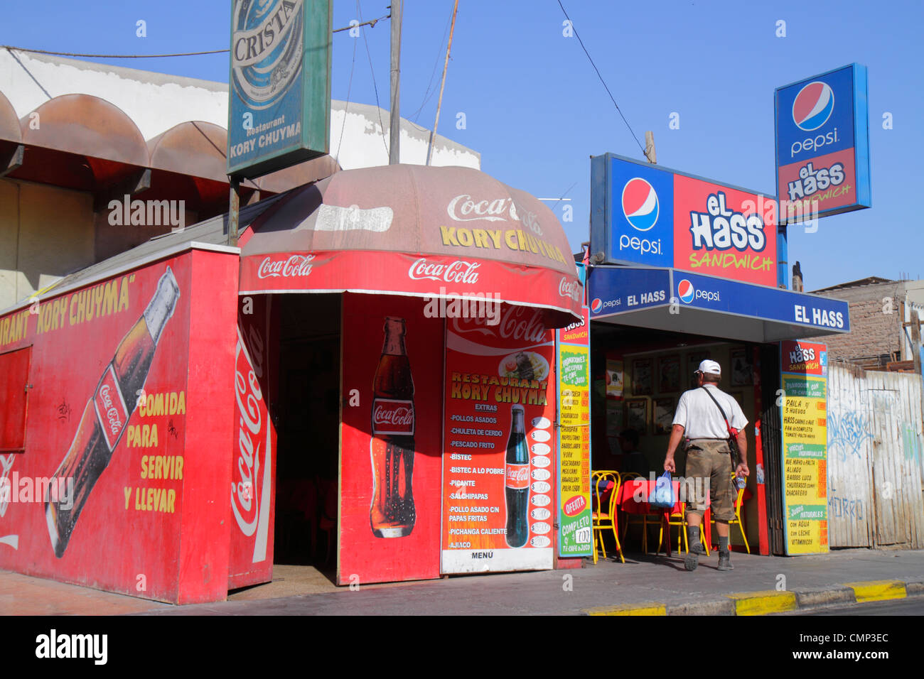 Arica Chile,Avenida 18 de Septiembre,neighborhood restaurant,restaurants,food,dine,eat out,sandwich shop,sign,Coca Cola,Pepsi,competition,Hispanic man Stock Photo