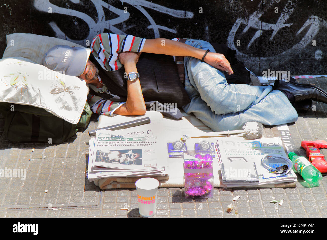 Santiago Chile,Providencia,Avenida Libertador Bernardo O'Higgins,street,sidewalk,Hispanic man men male adult adults,homeless,sleeping on street,newspa Stock Photo