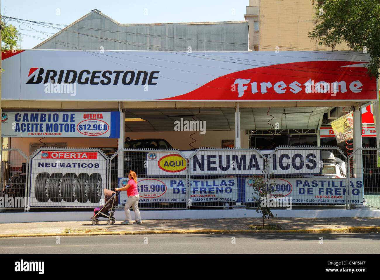 Santiago Chile,Providencia,Avenida Rancagua,Firestone Tire & Rubber Company,Bridgestone,American company,tires,retail sale,car services,sign,Spanish,H Stock Photo