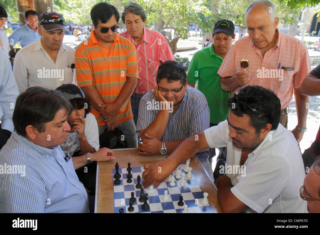 Santiago Chile,Plaza de Armas,main public square,park,Hispanic ethnic man men male adult adults,boy boys,kid kids child children,chess,board game,ches Stock Photo