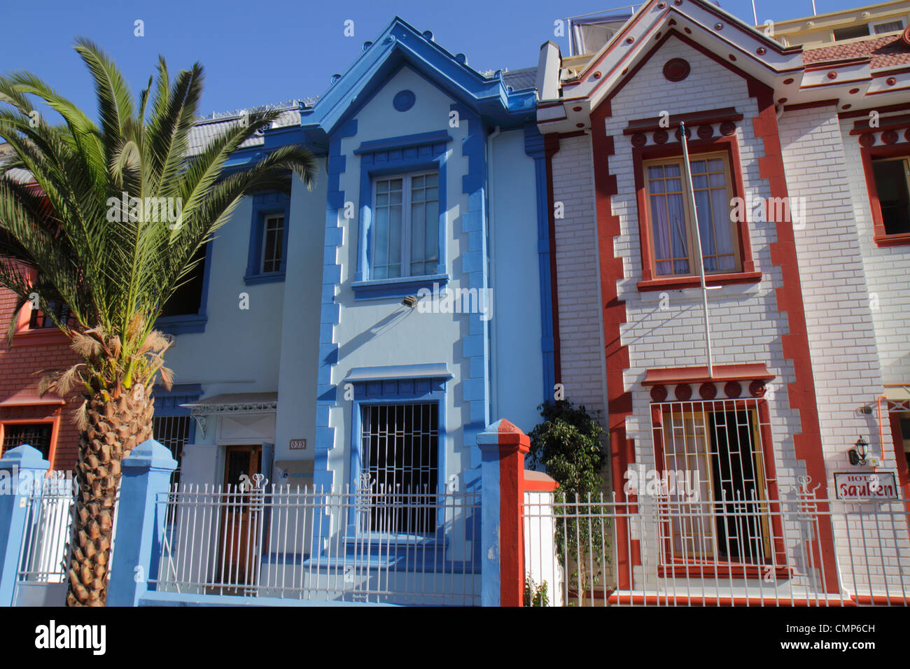 Santiago Chile,Providencia,Vina del Mar,neighborhood,housing,attached homes,house home houses homes residence,two story,bright color paint job,wrought Stock Photo