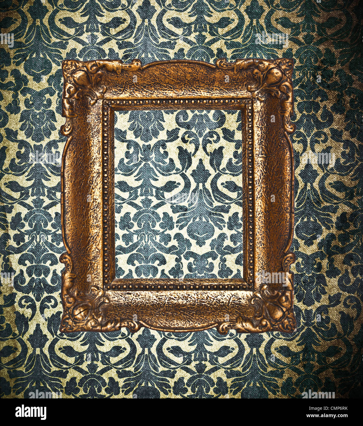 Ornamental gold frame on a damask wallpaper Stock Photo