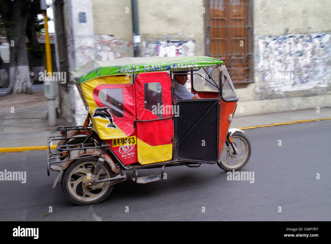 Lima Peru,Barranco District,Avenida Pedro D'Osma,street scene,alternative transport,motorcycle taxi,taxis,mototaxi,taxis,pillion,tricycle,Hispanic man Stock Photo