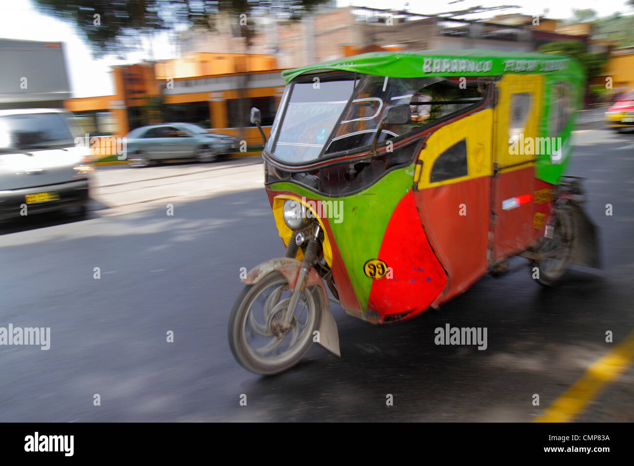 Lima Peru,Barranco District,Avenida Pedro D'Osmo,street scene,moving,alternative transport,motorcycle motorcycles taxi,taxis,mototaxi,taxis,pillion,pa Stock Photo