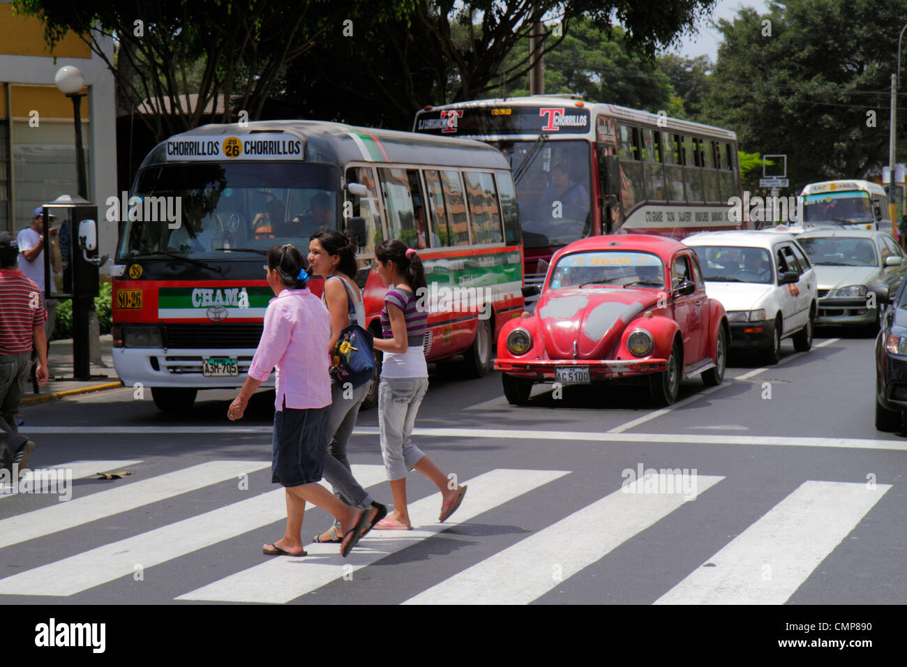 Lima Peru,Barranco District,Avenida Miguel Grau,street scene,red light,stopped traffic,bus,coach,car cars,Volkswagen,crossing,painted lines,Hispanic L Stock Photo