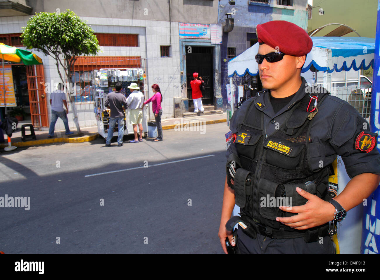 Lima Peru,Surquillo,Mercado de Surquillo,street scene,commercial district,Hispanic ethnic national guard,Policia Nacional,armed policeman,uniform,bere Stock Photo