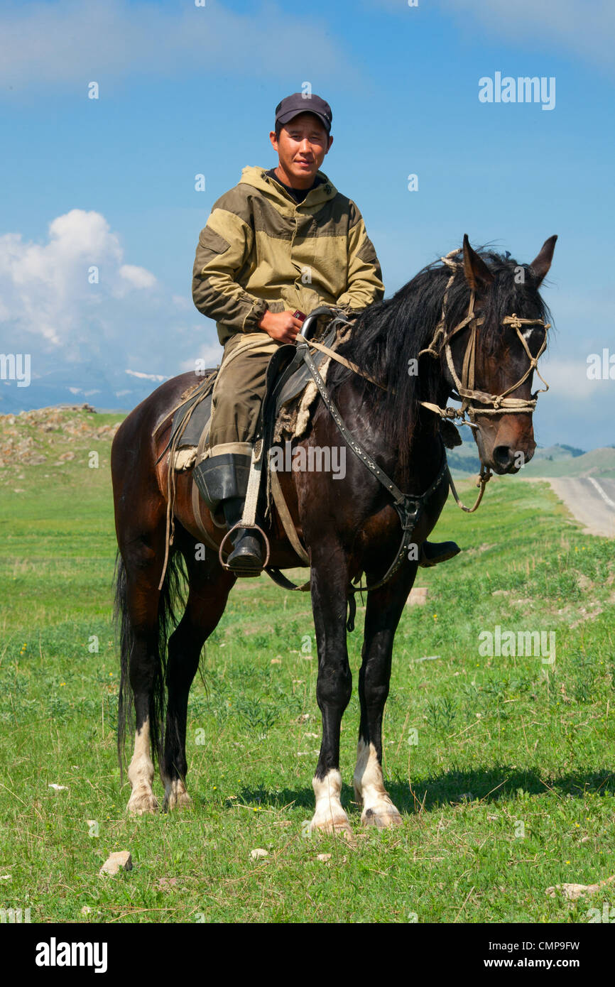 Nomad with his faithful horse in the steppes of Mongolia Stock Photo ...