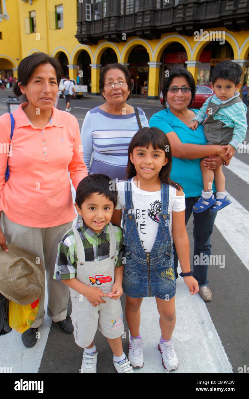 Lima Peru,Plaza de Armas,public square,Hispanic woman female women,mature,boy boys,male,girl girls,youngster,female kids children mother,parent,parent Stock Photo