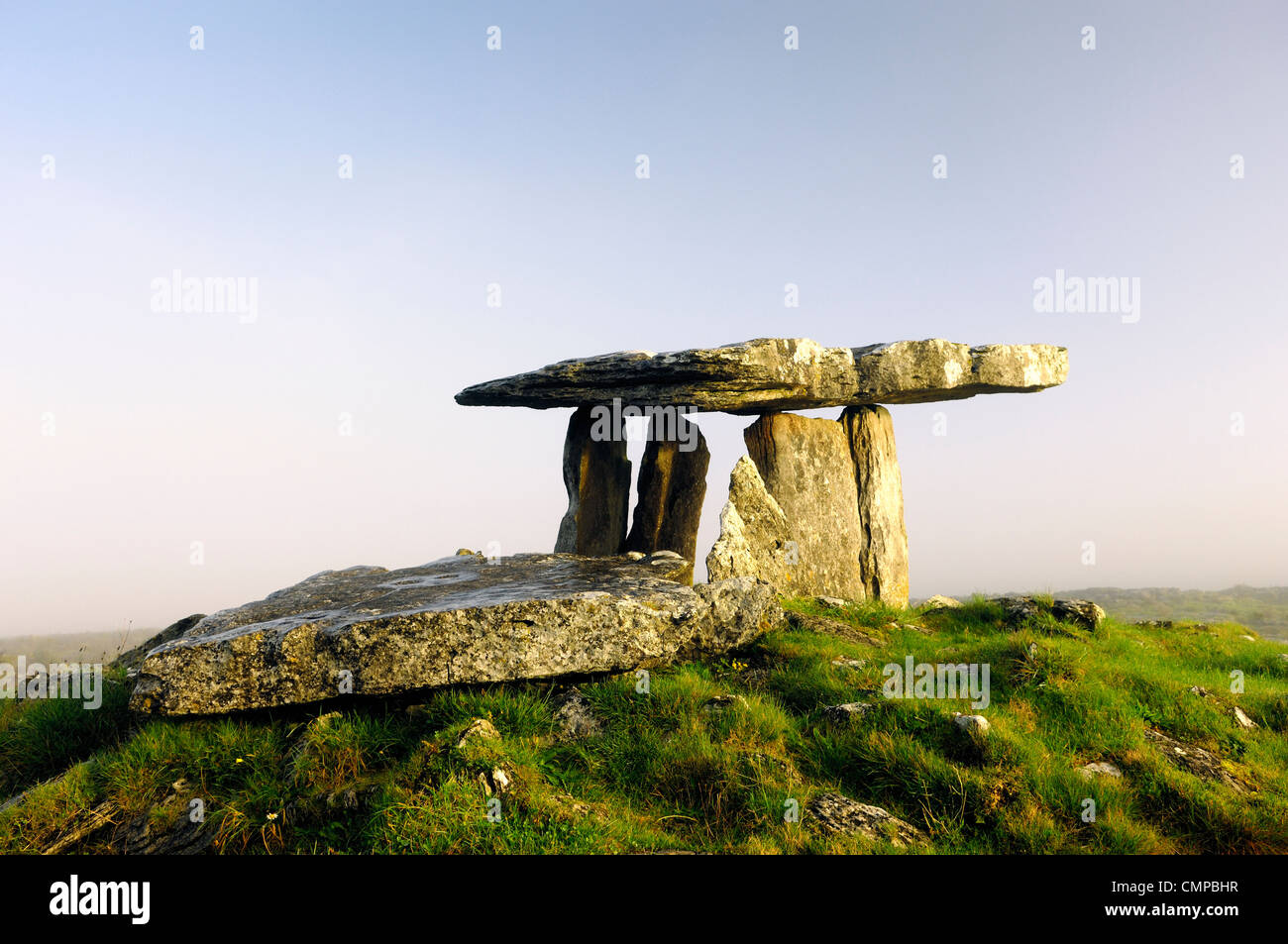 Poulnabrone prehistoric Stone Age dolmen tomb on The Burren limestone plateau near Cliffs of Moher, County Clare, Ireland Stock Photo