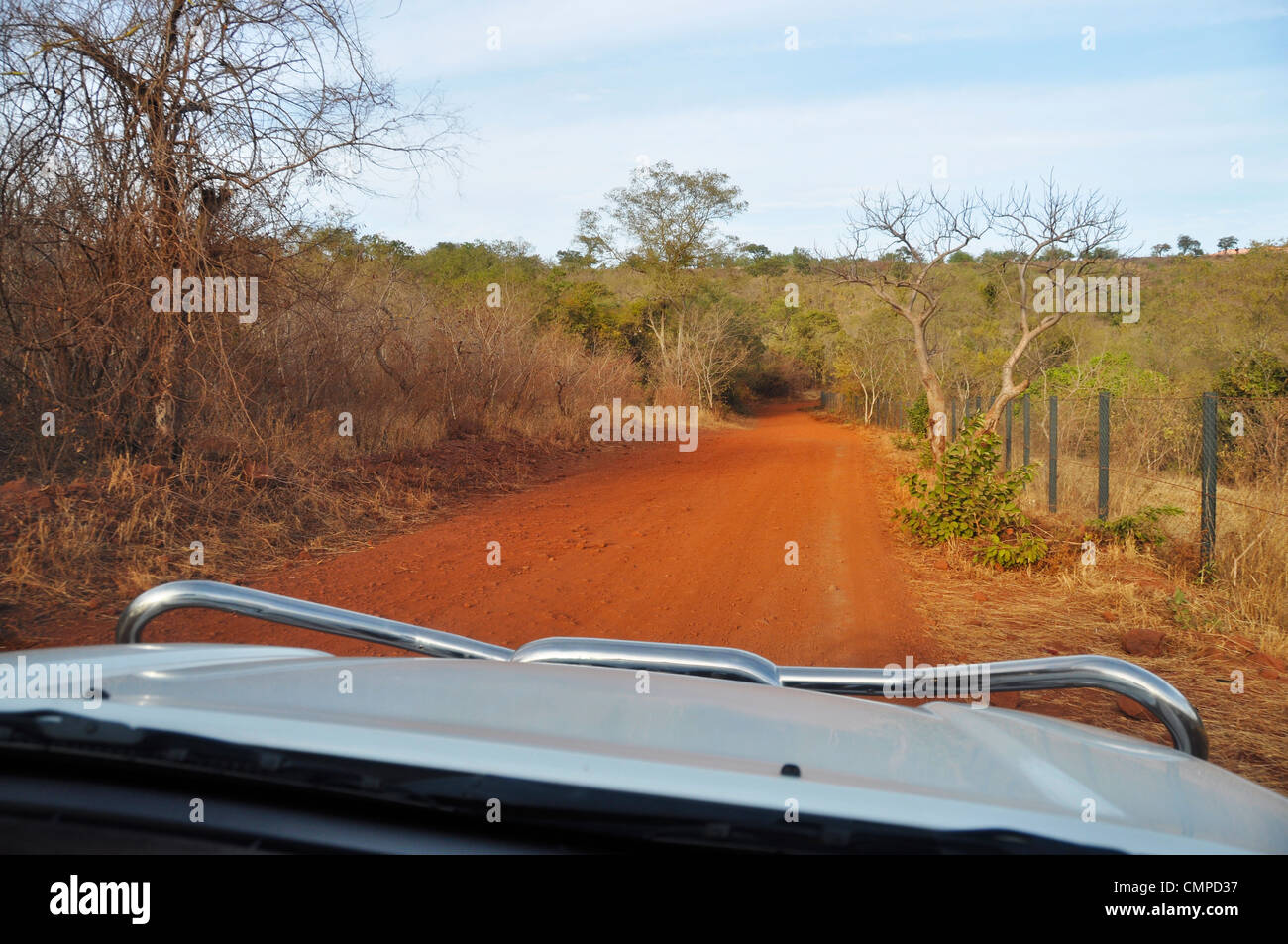 Driving a 4x4 on a laterite trail in Africa Stock Photo