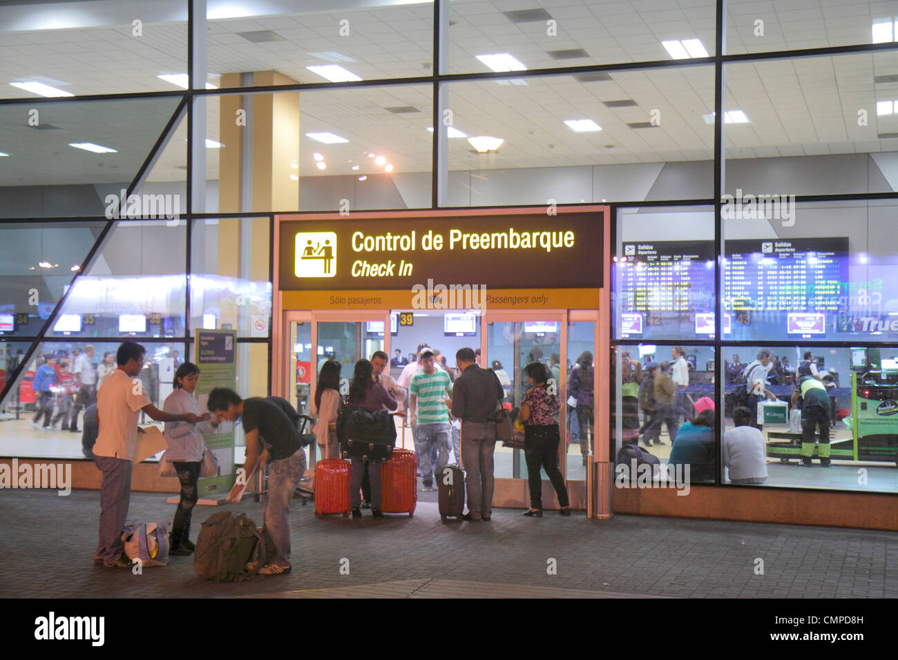 Lima Peru,Jorge Chávez International Airport,LIM,aviation,terminal,departures,sign,bilingual,Spanish,English,Hispanic man men male,woman female women, Stock Photo