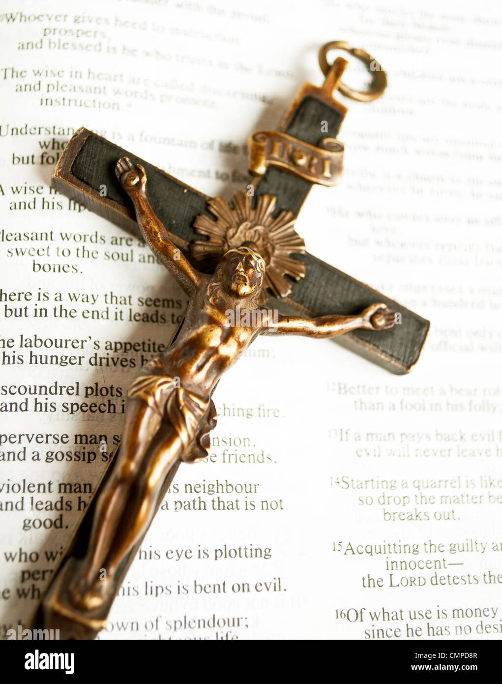Cross with crucified Jesus Christ on open bible Stock Photo - Alamy