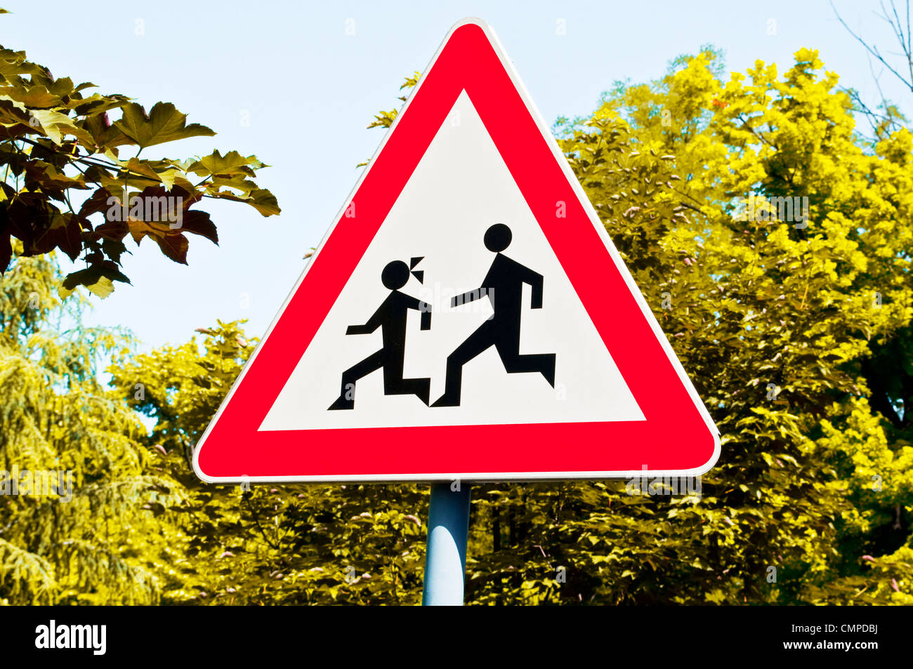 Warning school sign near street Stock Photo