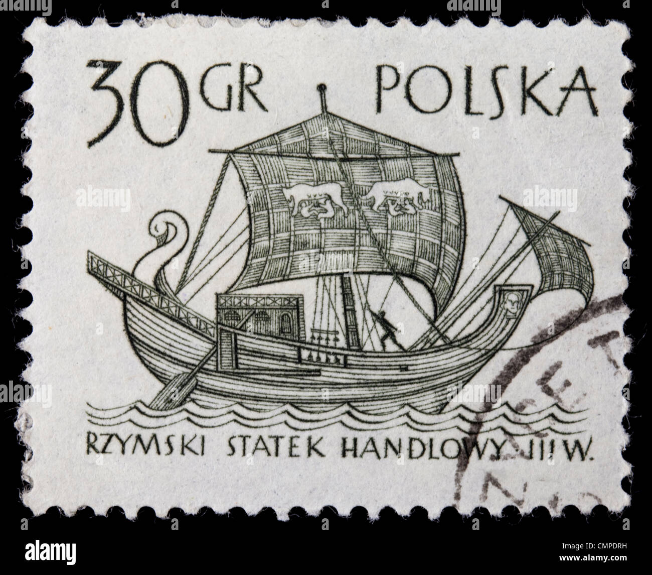 POLAND, circa 1960 - ancient Roman merchant sail ship on a vintage canceled post stamp, black drawing on white Stock Photo
