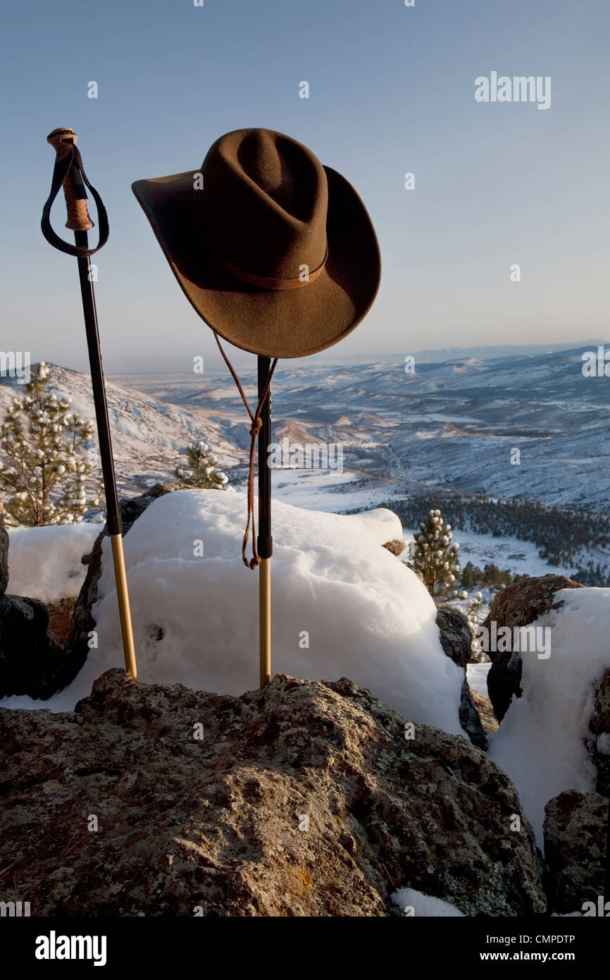 trekking poles and cowboy style hat in winter mountain scenery, Front Range of Rocky Mountains near Fort Collins, Colorado Stock Photo