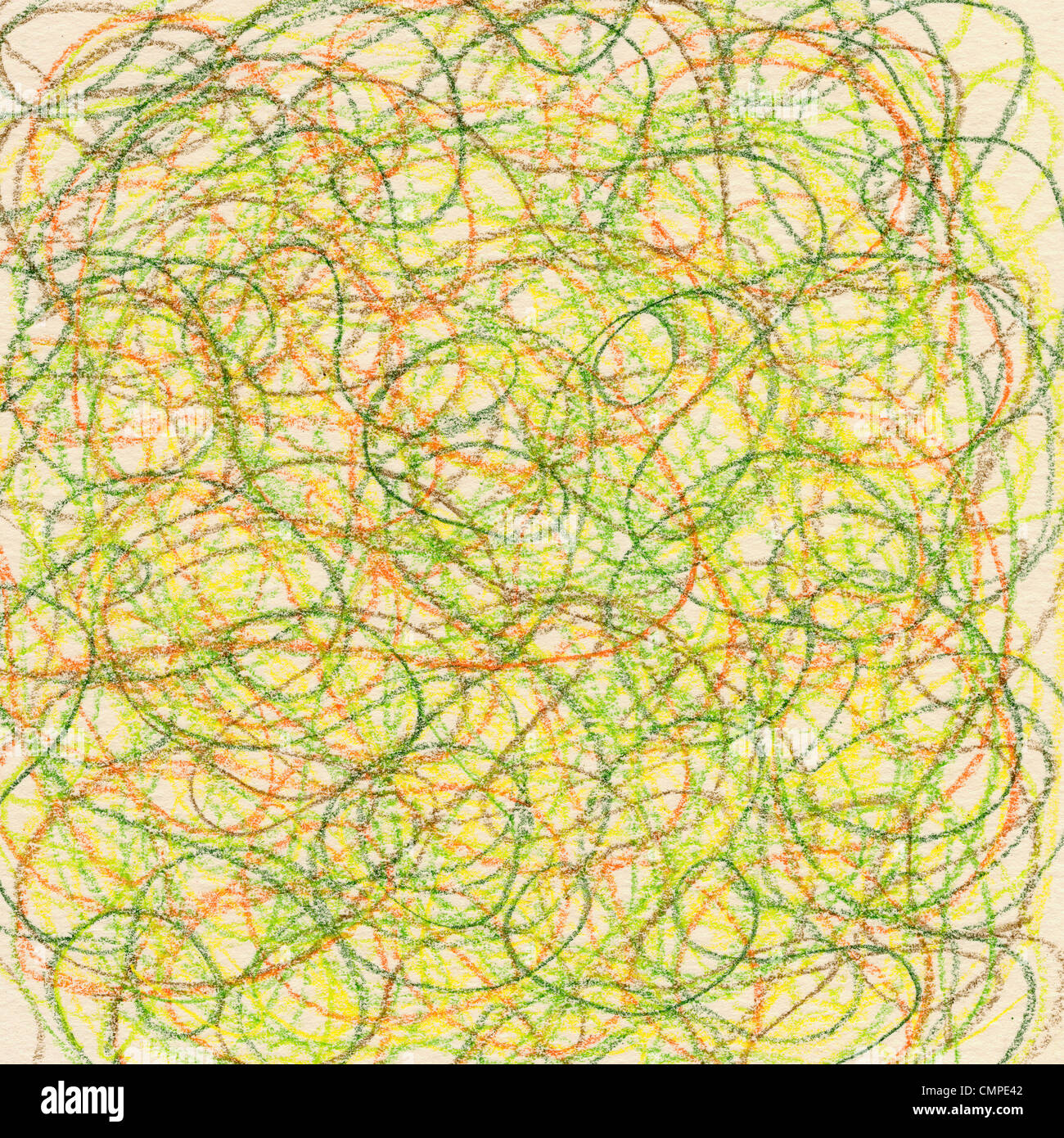 hand-drawn crayon circular scribble in green, red and yellow colors on ivory paper background Stock Photo