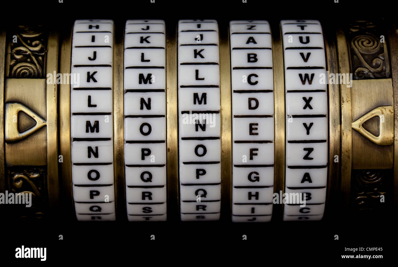 word money set as a password in combination puzzle box (cryptex) with rings of letters Stock Photo