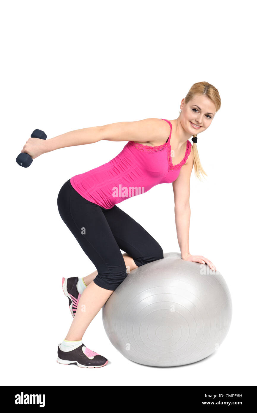 Young woman doing Standing Bent-Over Dumbbell Triceps Extension on ...
