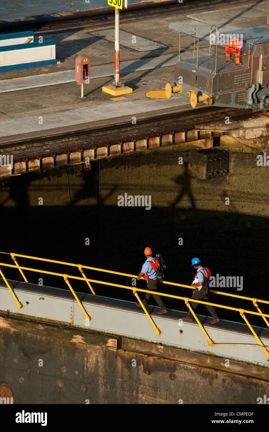 Workers walking over floodgate at Miraflores Locks,Panama Canal Stock Photo