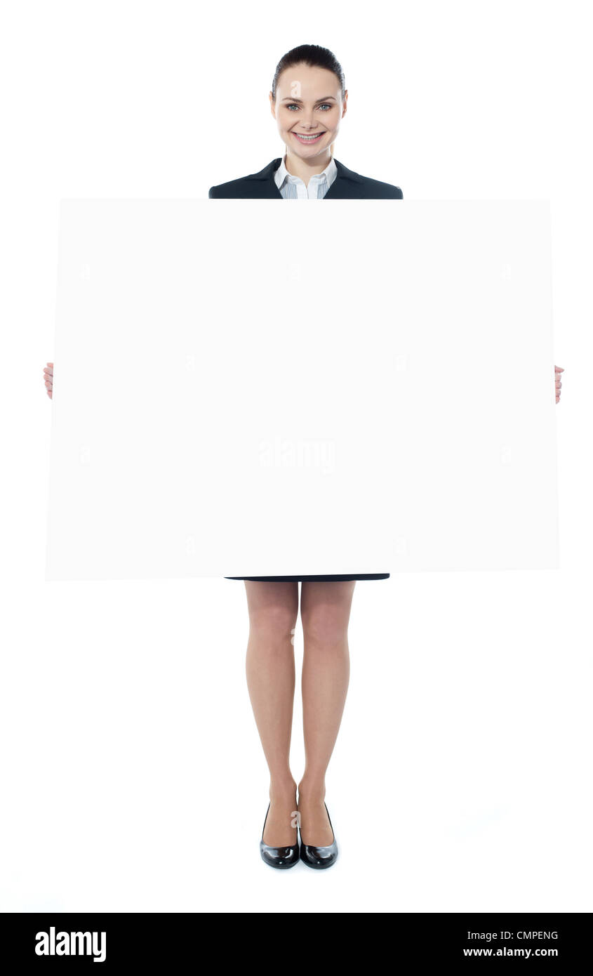Confident young executive with an advertising board, smiling at camera Stock Photo
