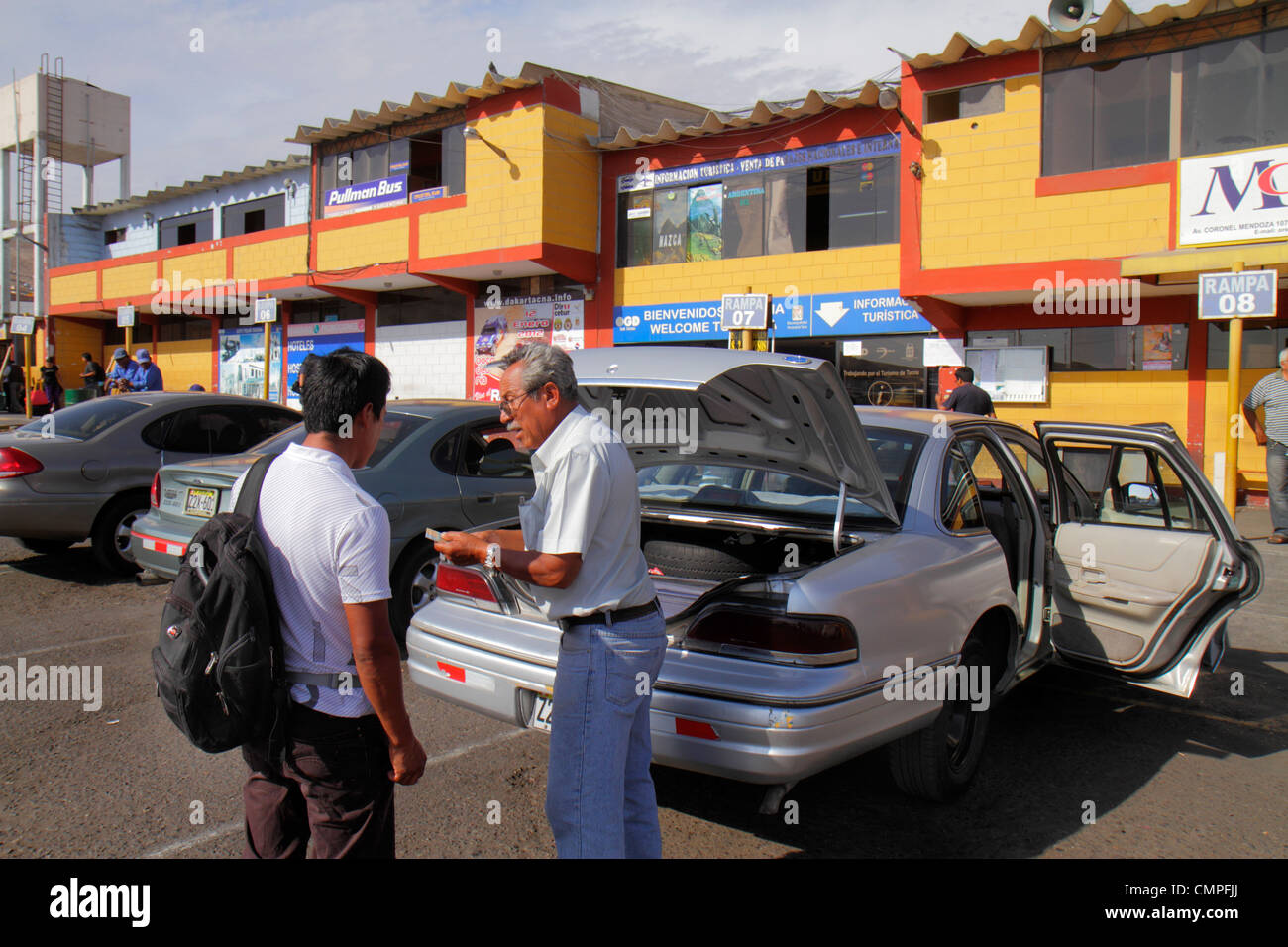 Tacna Peru,Panamericana,Pan American Highway,bus terminal,outside exterior,collective auto,driver,transport,Hispanic man men male adult adults,car,ope Stock Photo